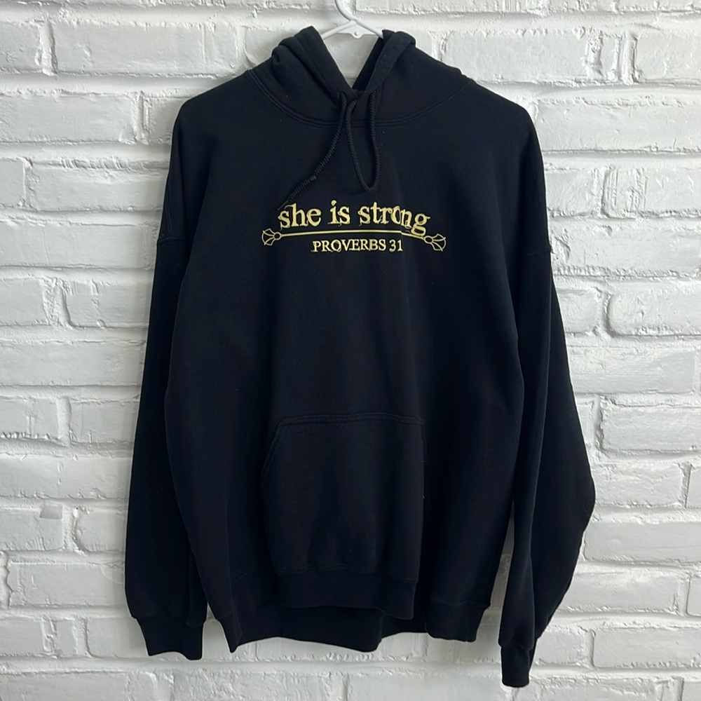 Woman’s “She Is Strong” Hoodie